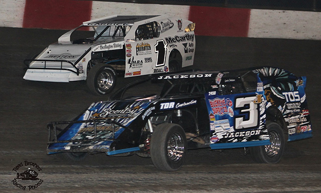 USRA Modified action between Lucas Jackson (3j) and Tim Karrick (1k) at Lakeside Speedway. (Reed Bros. Racing Photo)