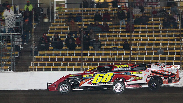 Kerry Davis edges out Darron Fuqua by half a car to win the USRA Modified feature at Lakeside Speedway on Friday, April 3. (Reed Bros. Racing Photo)